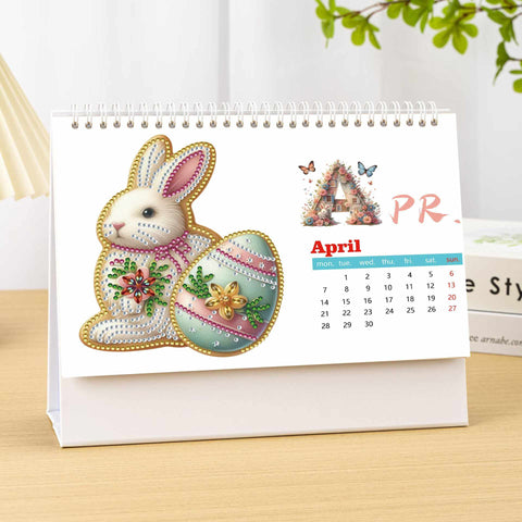 Image of April 2025 diamond painting desk calendar featuring Easter bunny and decorated egg design, DIY craft for monthly planning