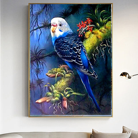 Image of diamond painting of a blue parakeet on a branch