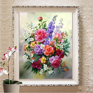 Diamond painting of a vibrant bouquet of roses, lilies, and wildflowers