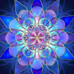 Diamond painting mandala in shades of blue, purple, and green.