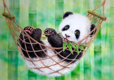Image of diamond painting of a panda cub in a hammock eating bamboo