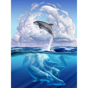 Diamond painting of a playful dolphin leaping out of a sparkling ocean.
