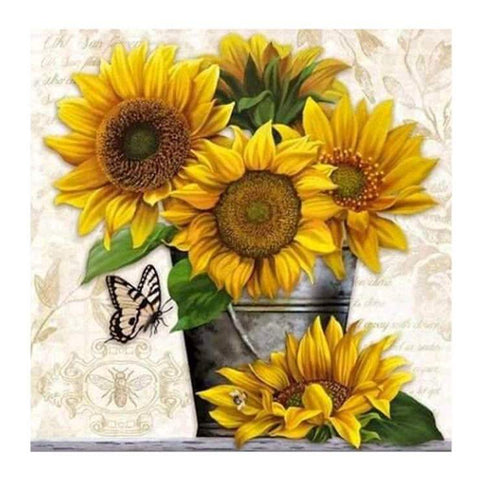 Image of Diamond painting of a sunflower in a rustic metal bucket.