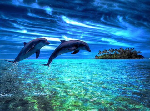 Image of Diamond painting of two dolphins leaping out of the ocean near a tropical island.