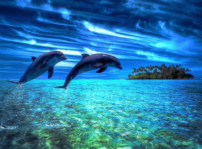 Diamond painting of two dolphins leaping out of the ocean near a tropical island.