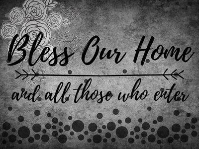 Diamond painting with the inspirational quote "Bless our home and all those who enter," surrounded by floral elements and a textured background.