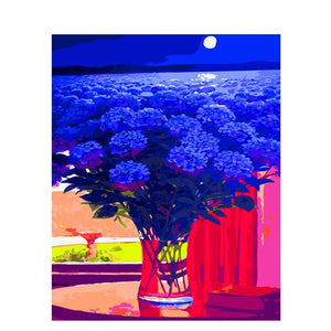 Diamond painting of a vase filled with blue hydrangeas, with a seascape and a full moon in the background.