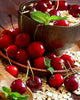 Diamond painting of fresh cherries in a bowl with oatmeal