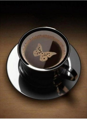 Image of Diamond painting of a coffee cup with a butterfly-shaped design