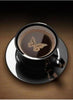 Diamond painting of a coffee cup with a butterfly-shaped design