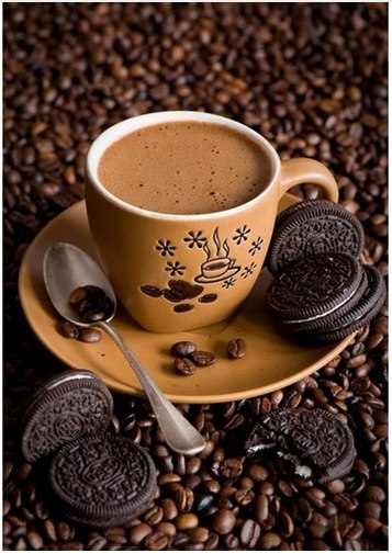 Diamond painting of a cup of coffee with Oreo cookies and coffee beans