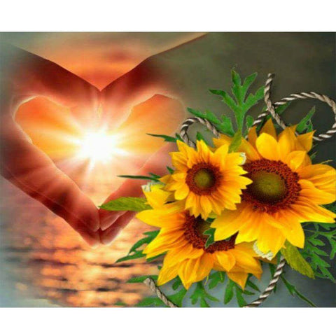 Image of Diamond painting kit with hand making a heart shape next to sunflowers