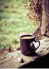 Diamond painting of a heart-shaped coffee cup on a wooden table with a spoon