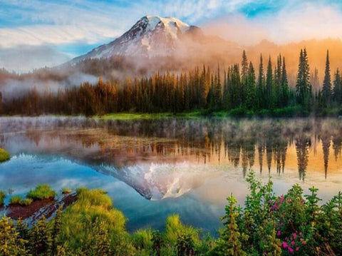 Image of Diamond painting of a lake reflecting a snow-capped mountain with evergreen trees in the foreground.