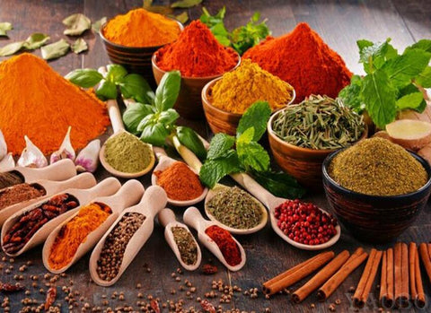 Image of Diamond painting featuring a variety of colorful spices and herbs arranged on a wooden table.