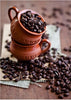 Diamond painting of two stacked clay cups filled with coffee beans