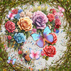 Sparkling heart-shaped arrangement of multicolored roses with interspersed butterflies in a diamond painting, set against a backdrop of greenery and artistic paint splatters