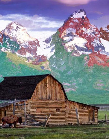 Image of Diamond painting of a barn in a hillside with mountains in the background.