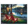 Diamond painting kit featuring a cozy cabin nestled near a lake with majestic mountains in the background.