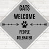 Diamond painting of a sign that says "Cats Welcome, People Tolerated," with a paw print and arrows.