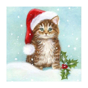 Diamond painting of a fluffy kitten wearing a Santa hat, sitting in the snow.
