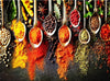 Diamond painting of a colorful assortment of spices in metal spoons