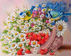 Diamond painting of two blue birds perched on a basket filled with daisies and strawberries