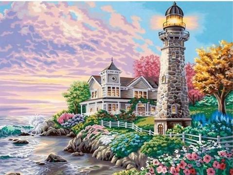 Image of Diamond painting of a lighthouse and a house near the ocean at sunset