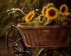 Diamond painting of a bicycle with a basket overflowing with bright yellow sunflowers.