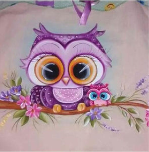 Diamond painting of a chibi owl perched on a branch with pink flowers.