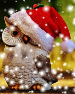 Diamond painting of a festive Christmas owl wearing a red Santa hat