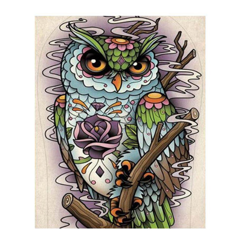 Image of Diamond painting of a colorful doodle owl with big eyes, and a yellow beak perched on a branch.