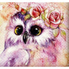 Diamond painting of a colorful owl with a crown of flowers