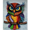 Diamond painting of a colorful owl with big yellow eyes perched on a branch.