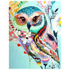 Diamond painting of a beautiful floral owl with a body formed by pink and purple flowers, perched on a branch.