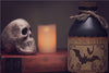 diamond painting of a spooky potion bottle with a bat wing label and a skull