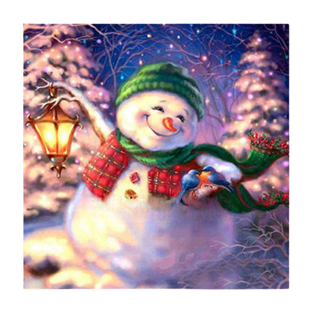 diamond painting of a smiling snowman holding a lantern in a winter scene