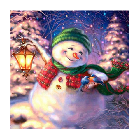 Image of diamond painting of a smiling snowman holding a lantern in a winter scene