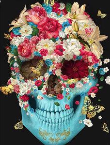 Diamond painting kit featuring a colorful sugar skull decorated with blooming flowers and butterflies.