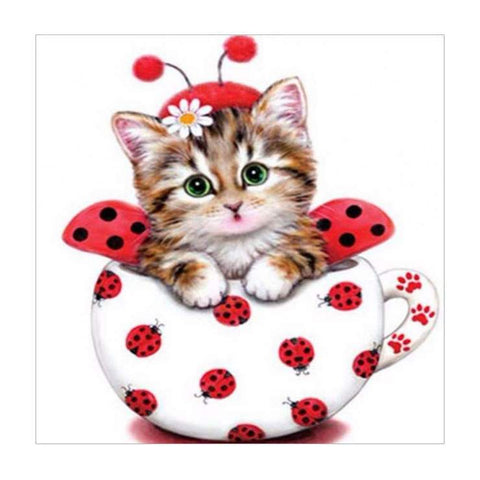 Image of diamond painting of a cute kitten dressed as a ladybug in a cup