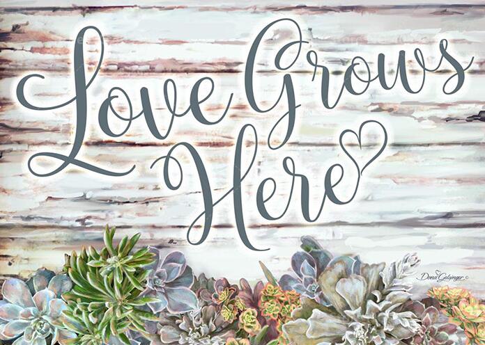 diamond painting of "Love Grows Here" with succulents