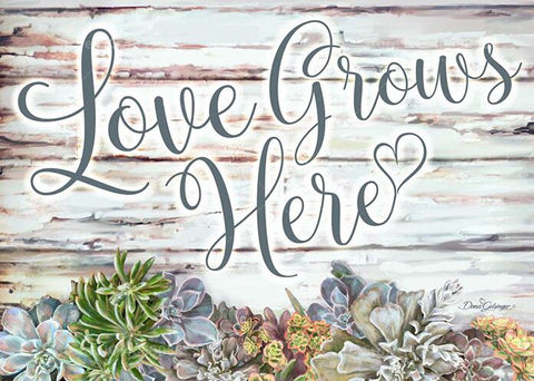 Image of diamond painting of "Love Grows Here" with succulents