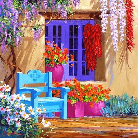 Image of diamond painting of a colorful Mediterranean house with flowers and a blue bench