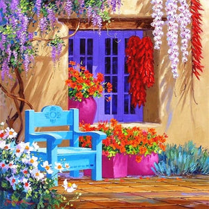 diamond painting of a colorful Mediterranean house with flowers and a blue bench