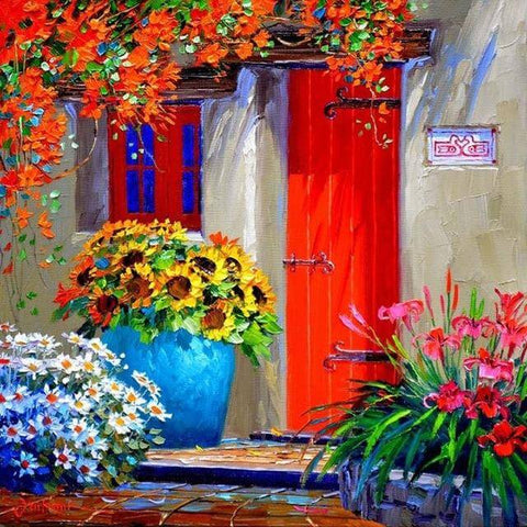 Image of diamond painting of a Mediterranean house with a red door and colorful flowers