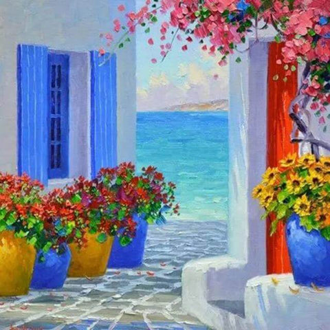 Image of diamond painting of a Mediterranean house with colorful flowers and a sea view