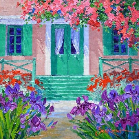 Image of diamond painting of a Mediterranean house with colorful flowers and a green door