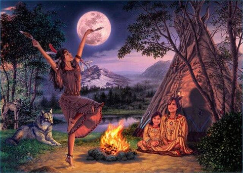 Image of diamond painting of a Native American woman dancing by a campfire