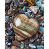 Diamond art featuring a heart-shaped stone amidst a collection of pebbles.