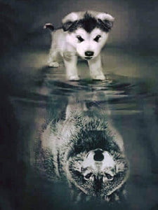 Diamond painting of a playful puppy gazing at its reflection in the water, which appears to be a wolf.